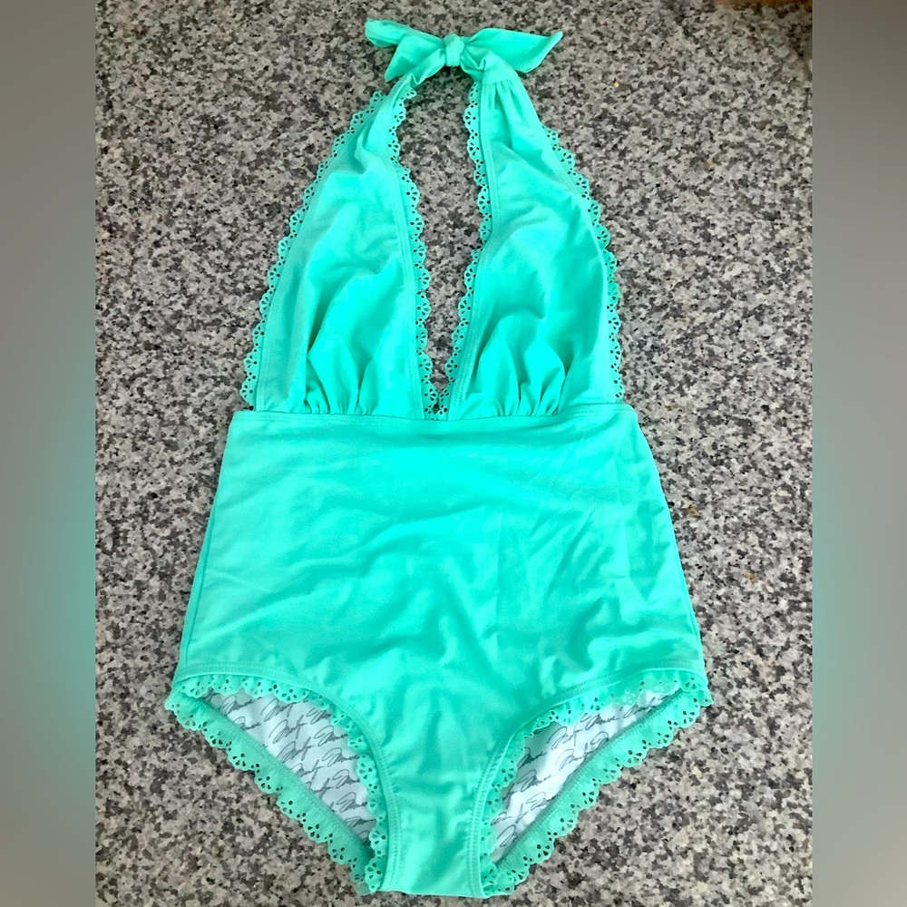 One-piece Mint Green Halter Swimsuit, with ruffle trim. Size S byMarilyn Monroe